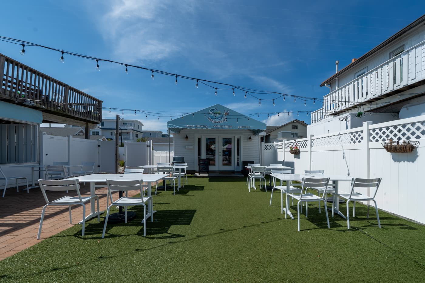 The outdoor patio alongside the restaurant at 2108 Dune Drive.