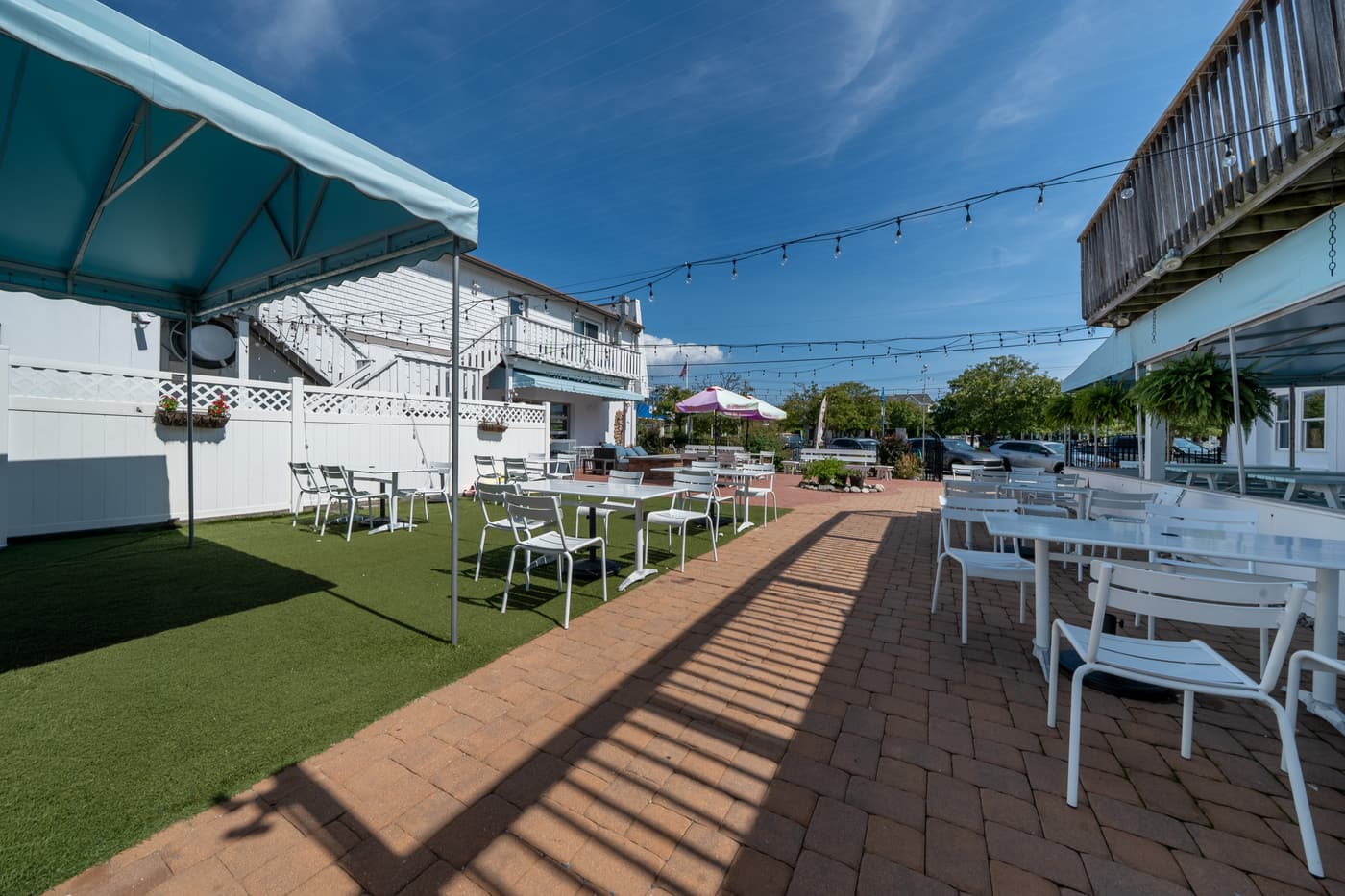 The outdoor patio alongside the restaurant at 2108 Dune Drive.