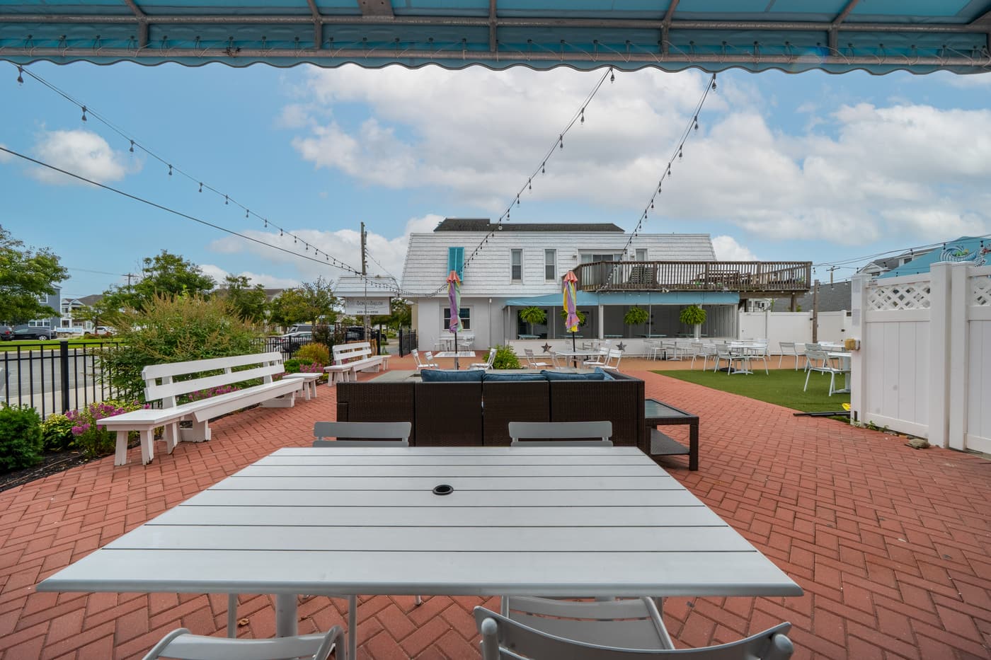 The outdoor patio alongside the restaurant at 2108 Dune Drive.